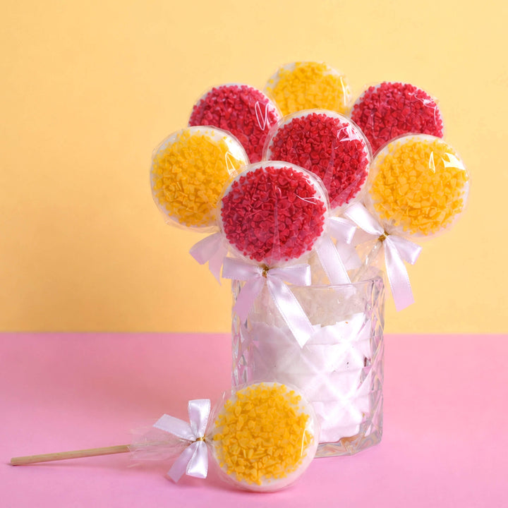 Sucettes blanches aux éclats de fraise et d'orange (10 pièces)