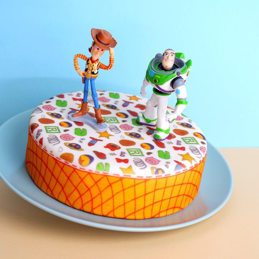 Cowboy Woody® & Buzz Lightyear® auf Spielzeug-Torte