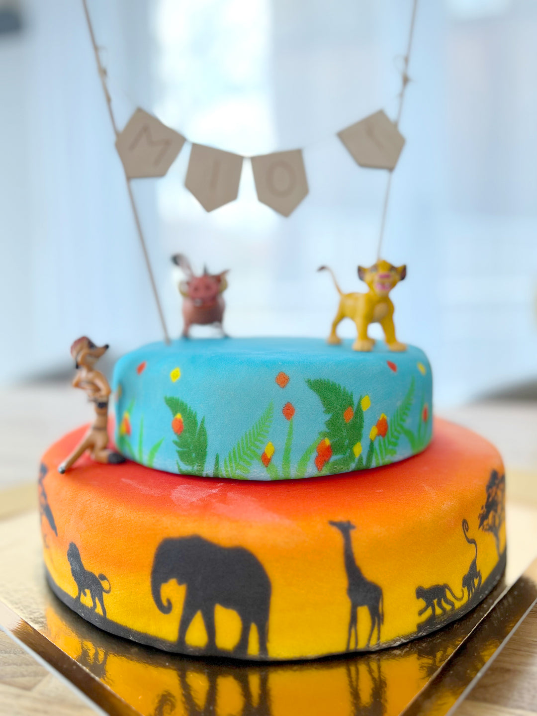 Simba®, Timon et Pumba® sur gâteau savane double-étage